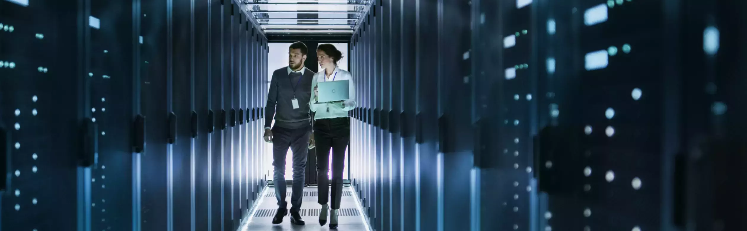 Man and woman walking server room